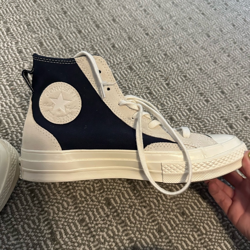 Never been worn Converse! Super cute just kind of hard to put on and off!